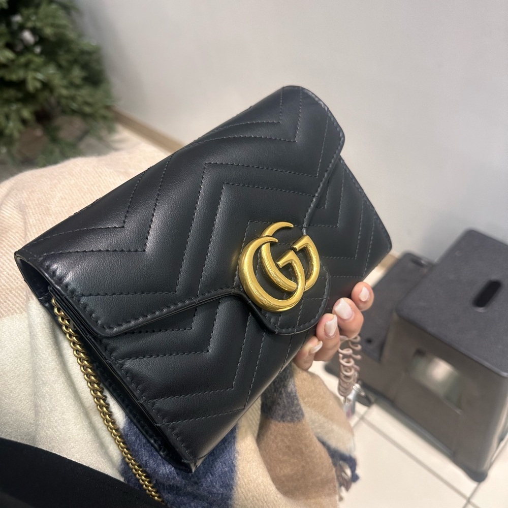 Gucci Black Leather Clutch with Gold Accent